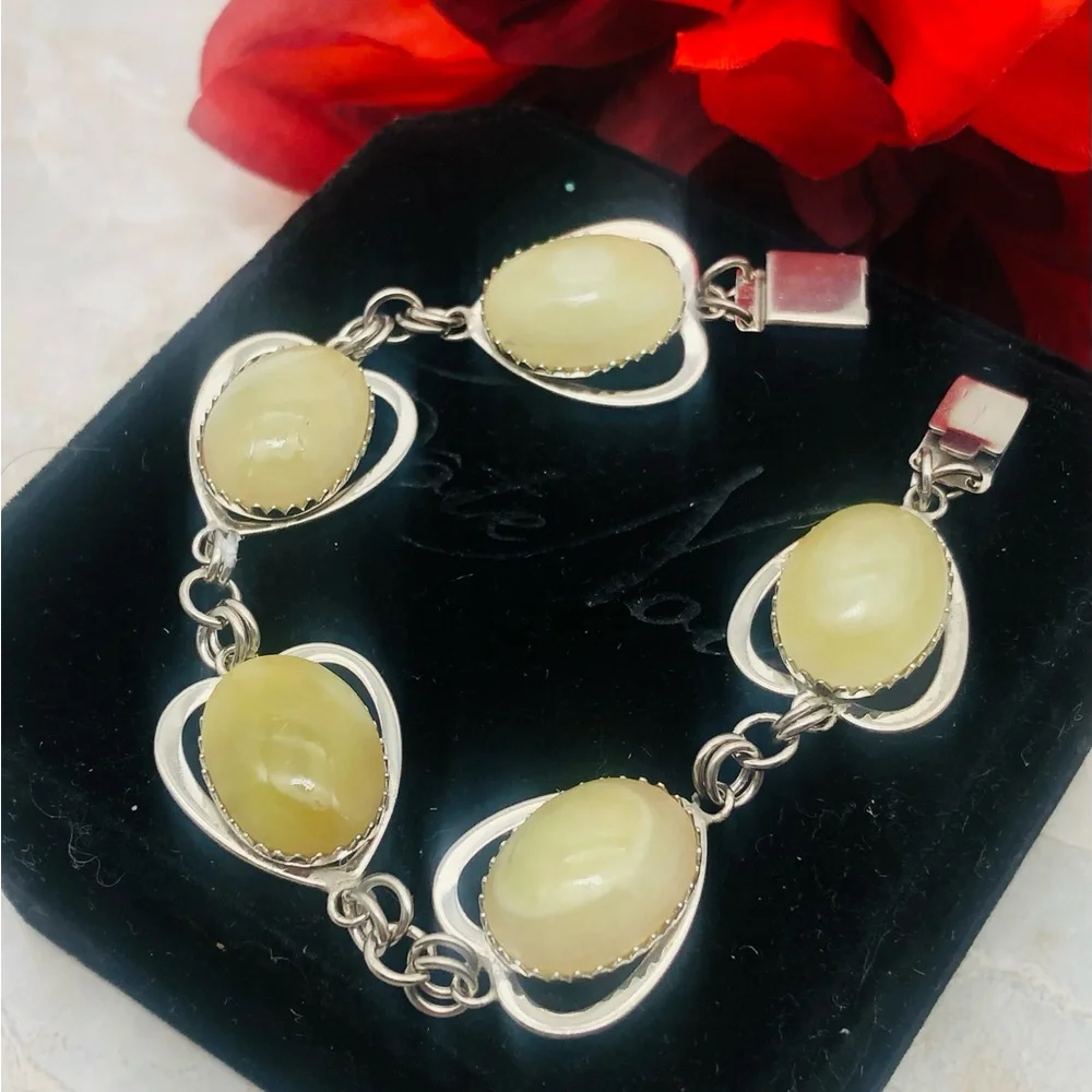 Rhodium Plated Bracelet with Pale Green Amber Cabochons